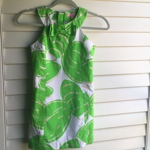 Lilly Pulitzer green, gold, and white dress.